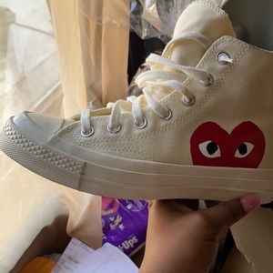I am selling  Comme De Garçons converse size 7wmn